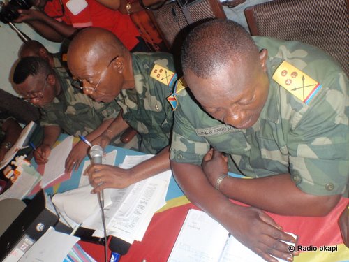 soldiers are doing homework work at their desks