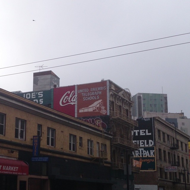 the billboards and advertits on this building give the city the name