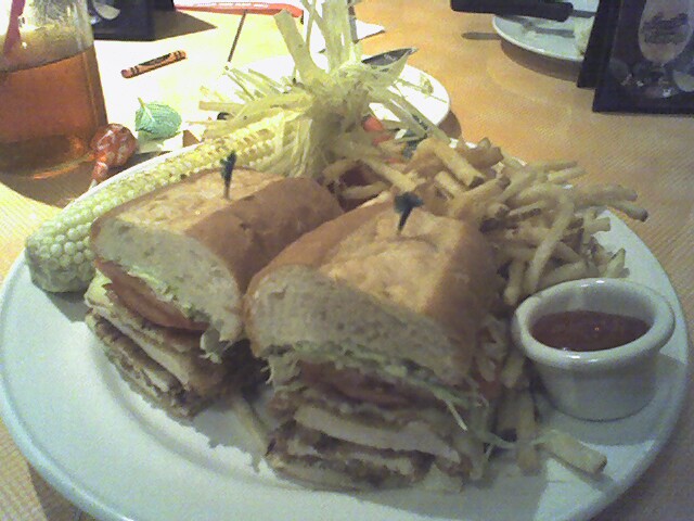 sandwiches and french fries on a white plate
