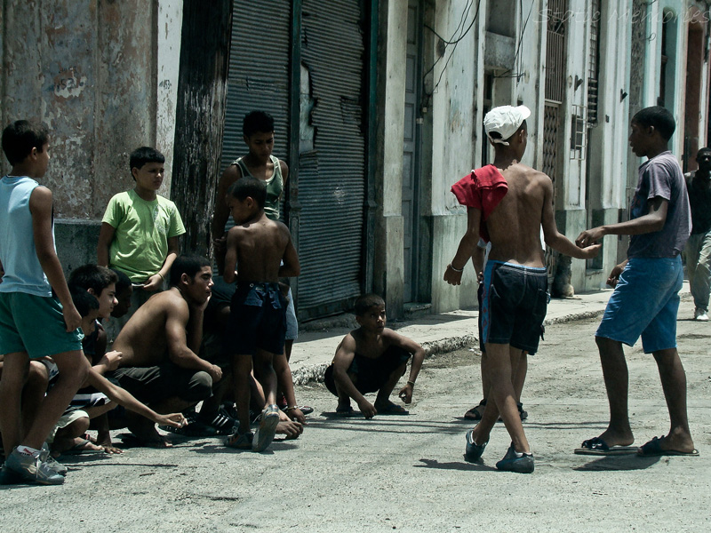 s are playing with each other in the street