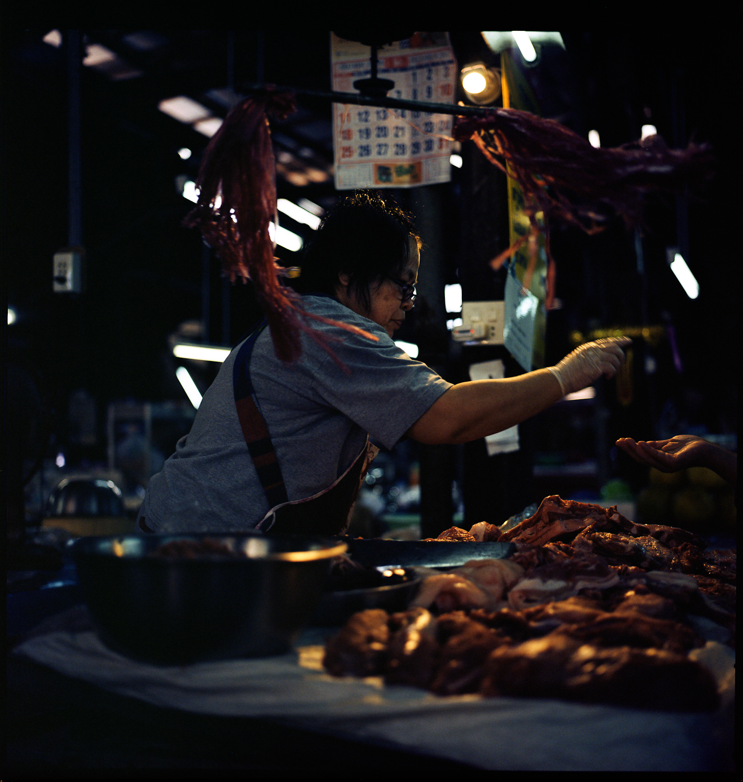 a man working in an oriental restaurant with food