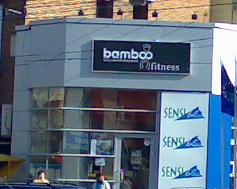 a shop sign and a building that says bamboo fitness