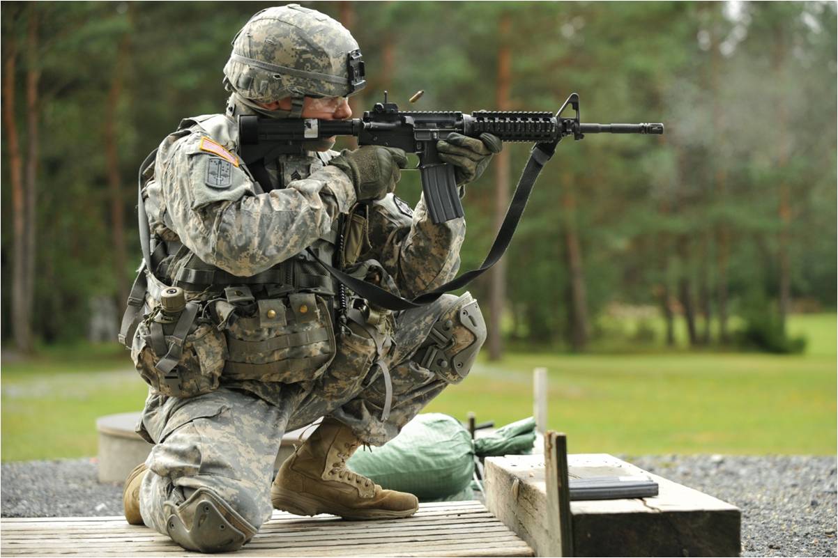 a soldier on a deck holding his rifle