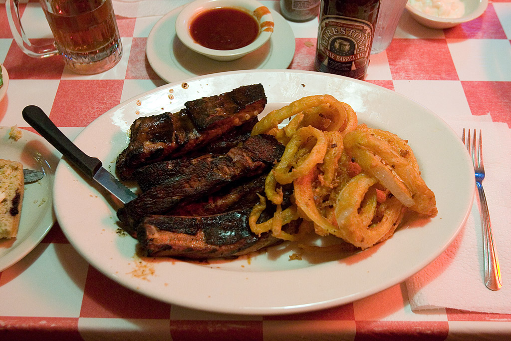 food including vegetables and steak on white plate