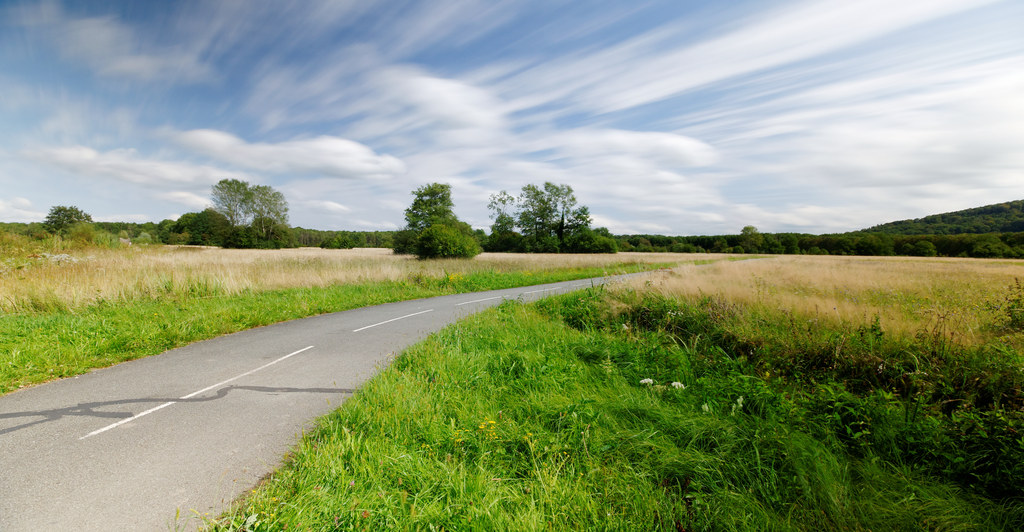 a bicycle parked along the side of the road