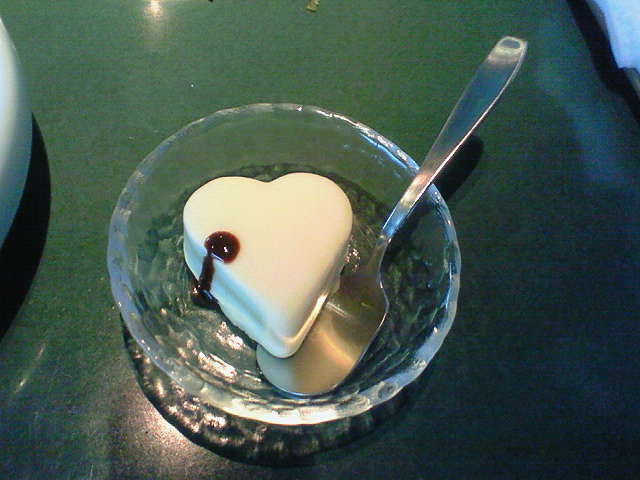 a heart shaped dessert sitting in a bowl