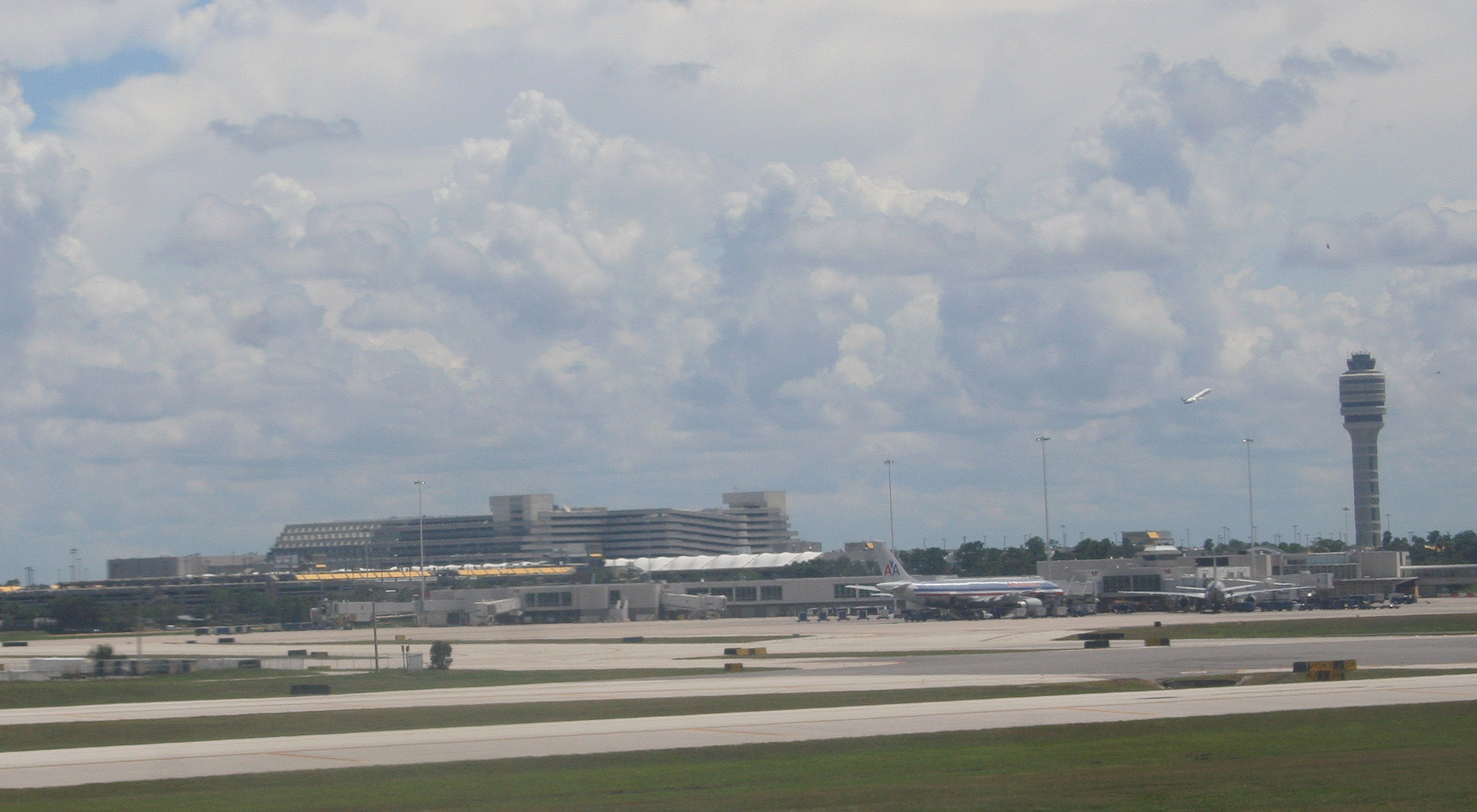 a large building sitting next to an airport