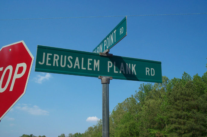 there is a stop sign at the intersection of jerusalem pink road and israel plank rd