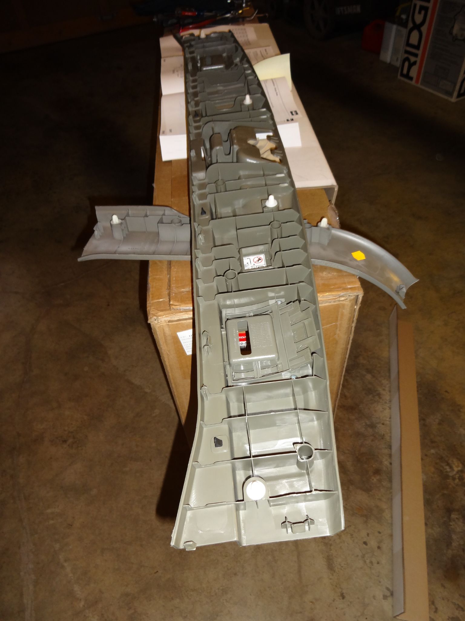 an airplane is being made with a box for storage