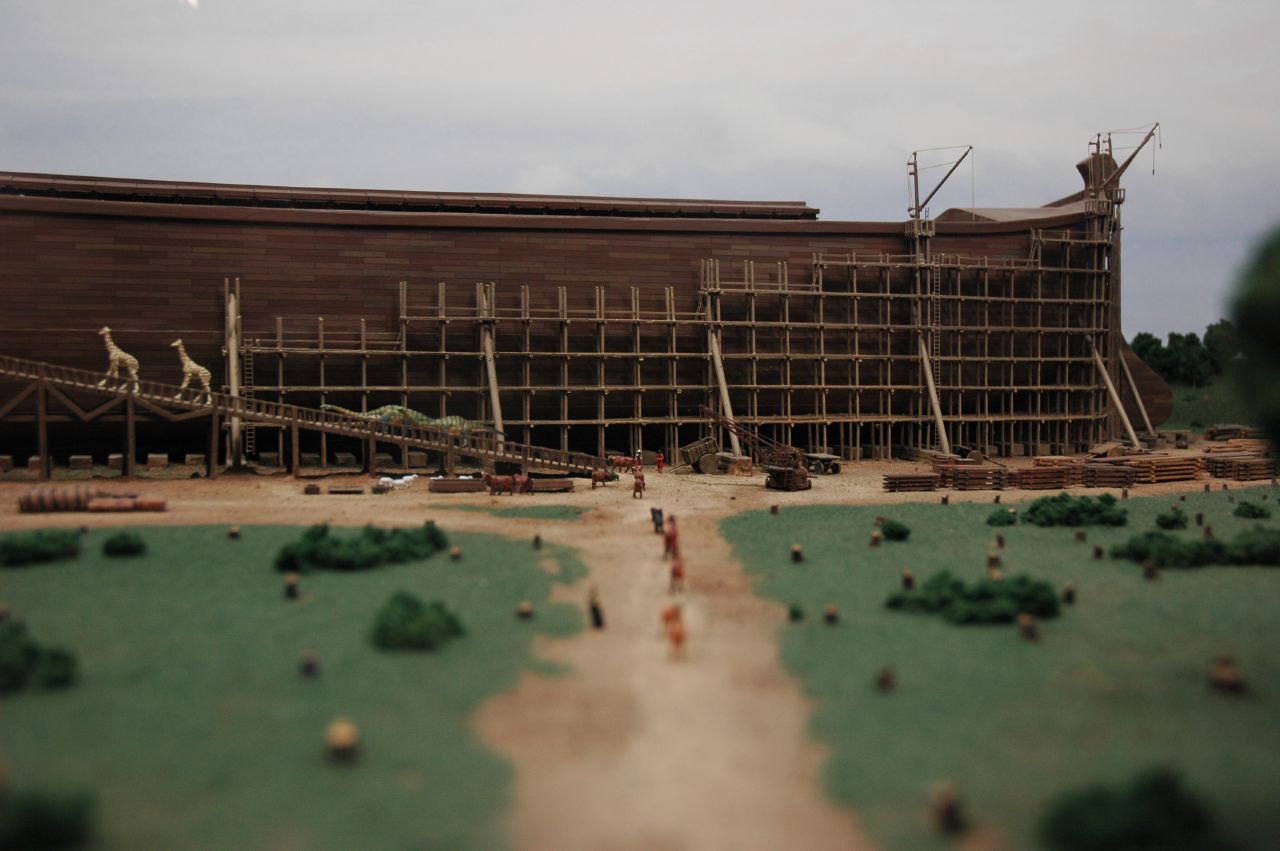 a large building with scaffoldings and wooden fences