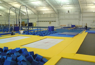 several empty exercise areas are set up in a large building