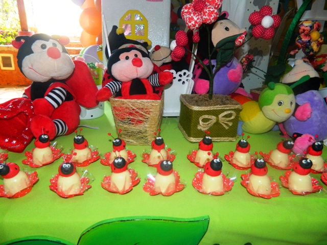 various stuffed animals and small decorations on a table