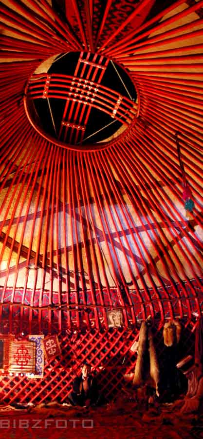 a round structure with several colorful colored wood sticks