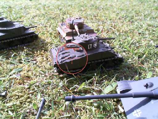 there are two different toy military vehicles on the grass