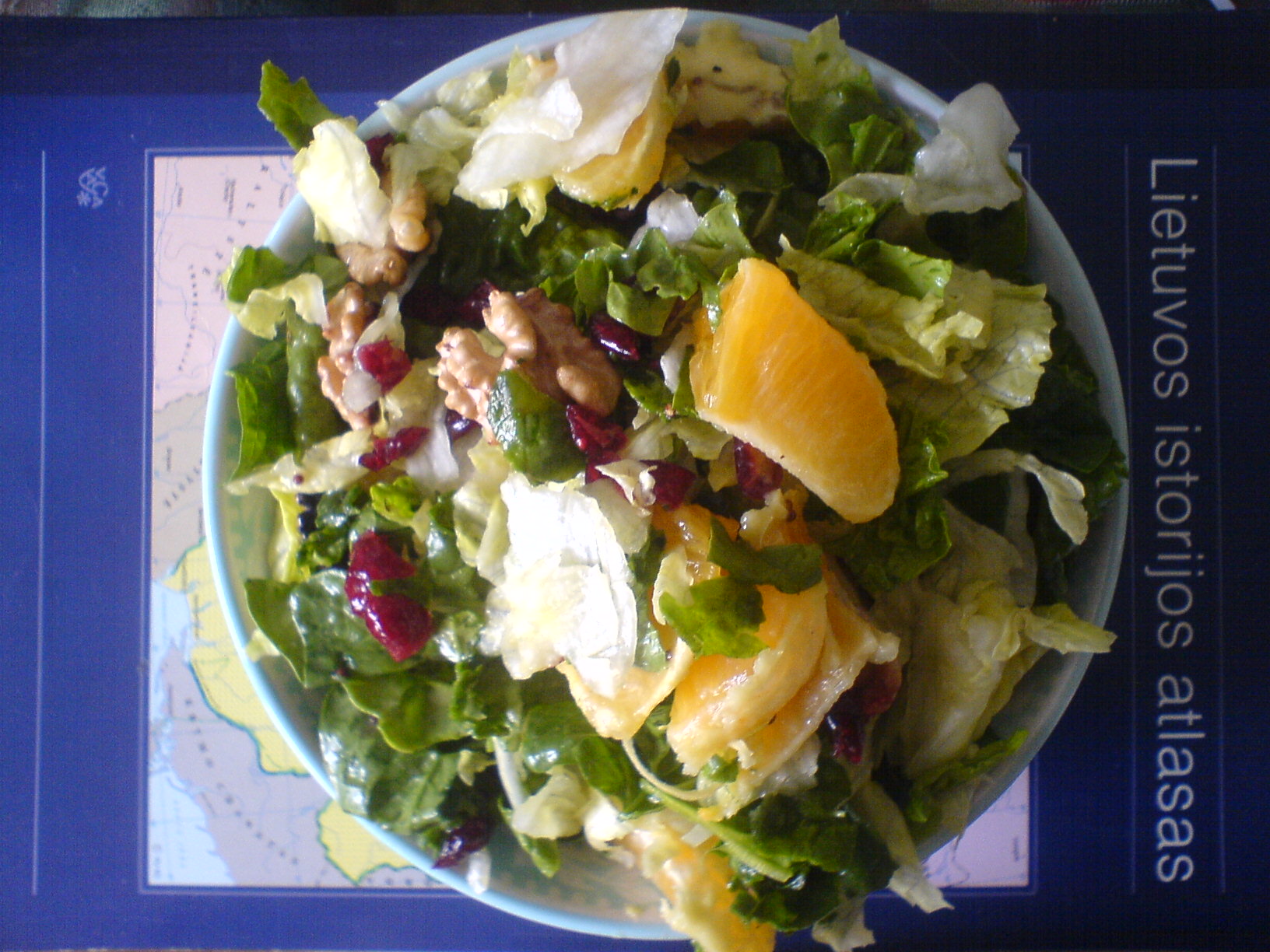 a plate full of salad and fruits with an ad that says there is always enough mayo dressing