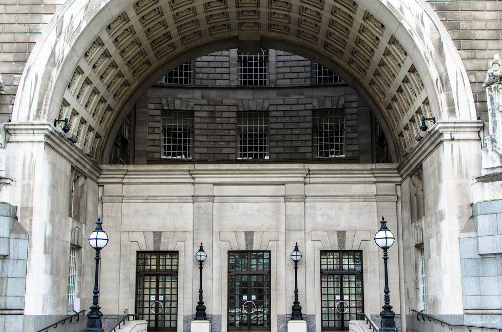 the entrance to a building is lined with light pillars