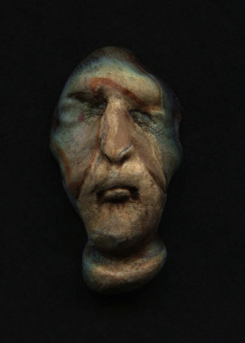 an artistically styled sculpture of a face