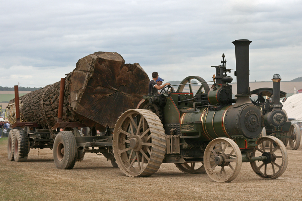 the people are working with the machine in the field