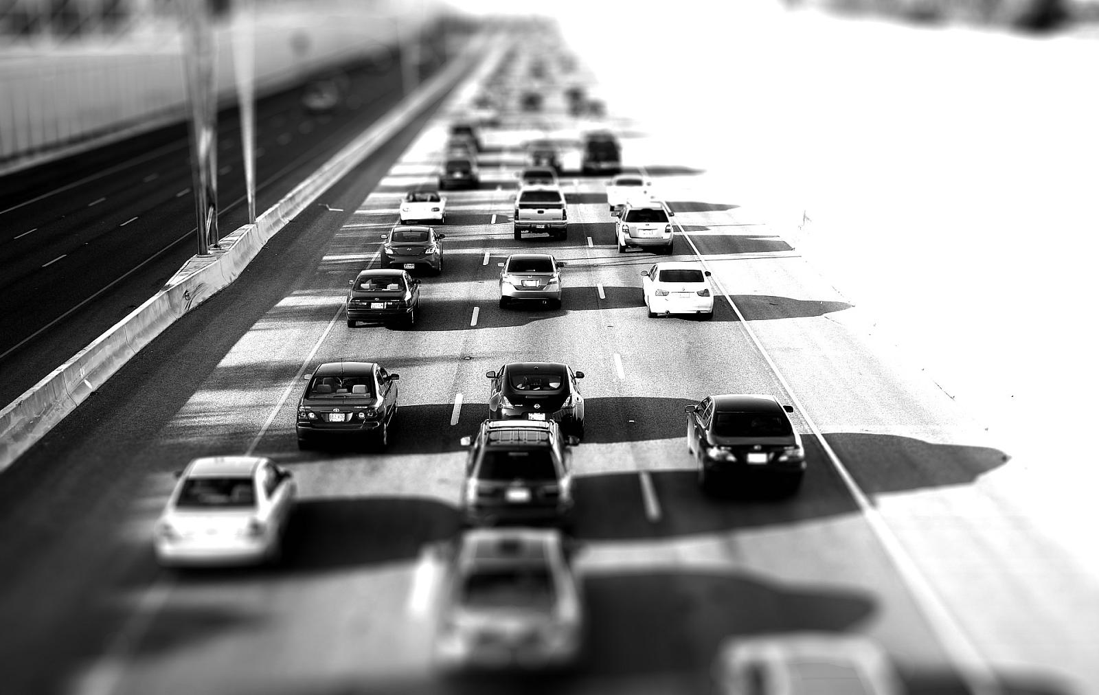 cars are backed up along the highway in heavy traffic