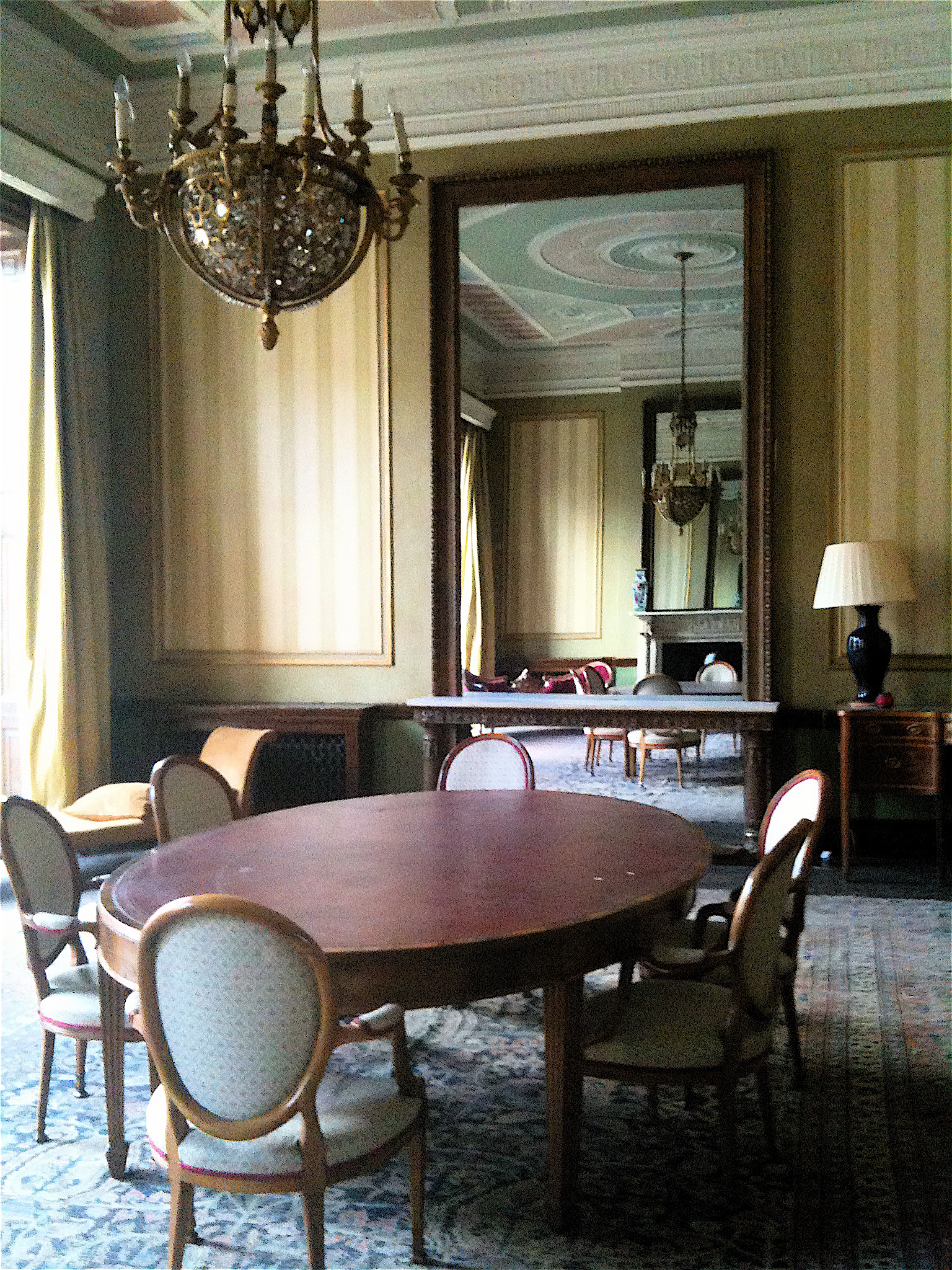 a formal dining room with a large oval table