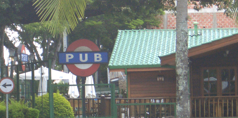 a pub with sign indicating where to go