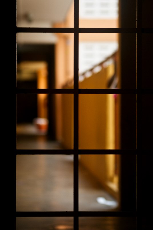 a hallway with brown walls and light shining through