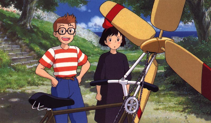 a man and woman standing next to each other holding a bicycle