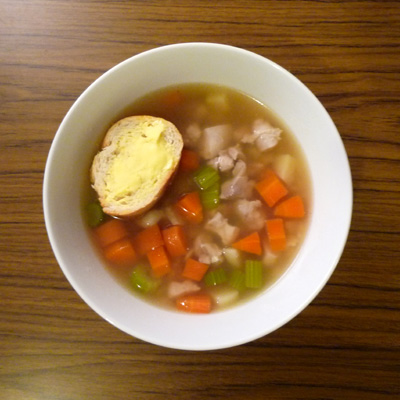 there is a bowl filled with stew and vegetables
