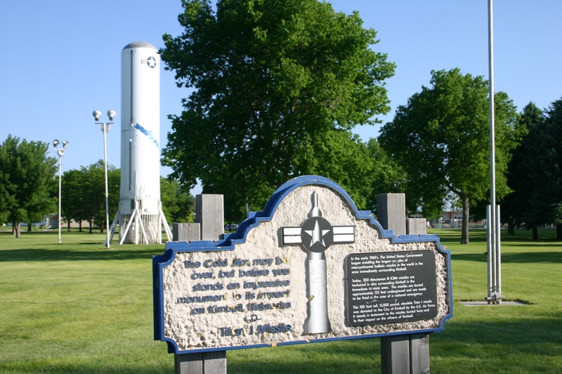 a sign in the middle of a park