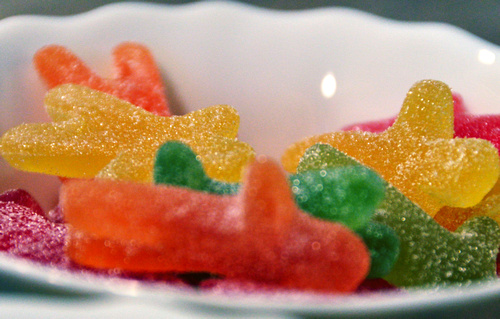 a small bowl of gummy bears in various colors