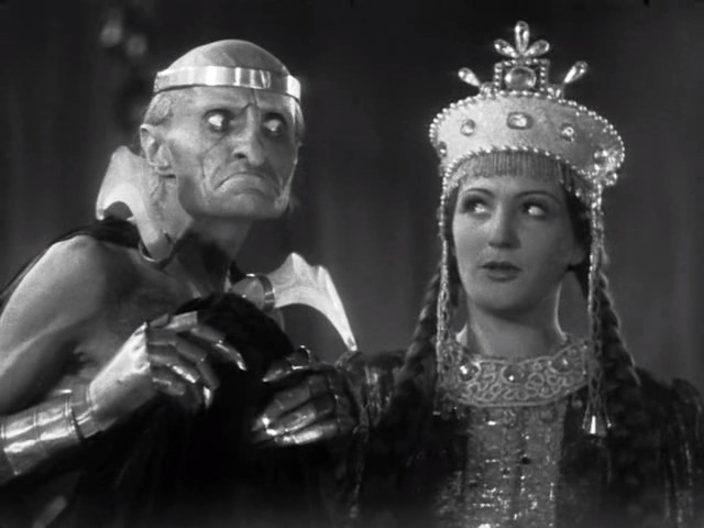 a still - life scene from a classic movie, which shows two people dressed as a demon and a princess