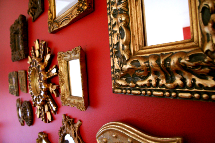 a collection of ornate mirrors in a fancy setting