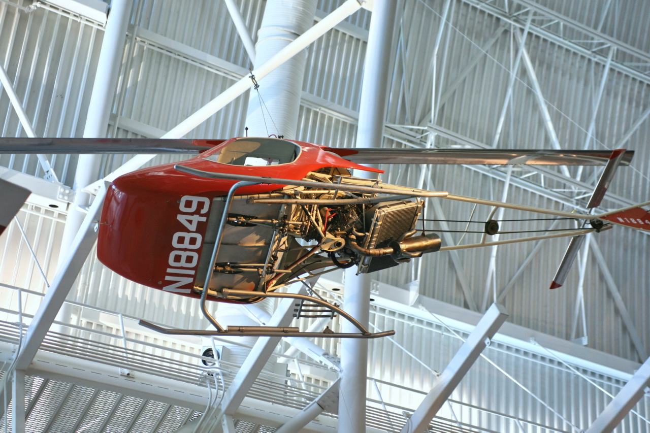 a helicopter that is inside a hangar on display