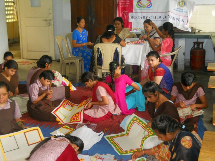 many children are playing with their crafts and books