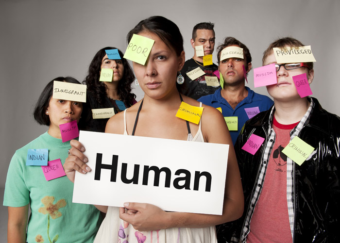 a group of people are holding a sign with the word human