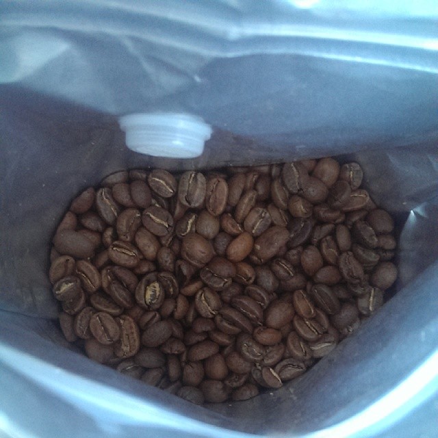 a bag full of coffee beans in it