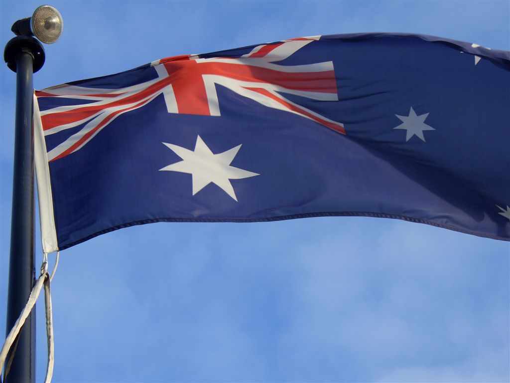 an australian flag waving on the wind