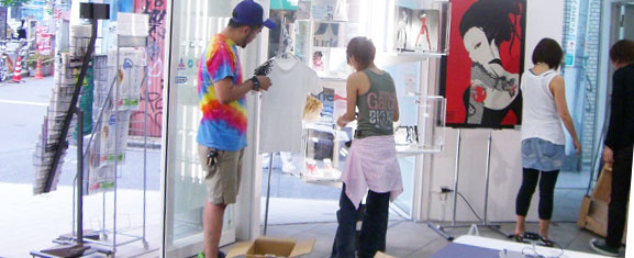 the group of people is talking at a art exhibit