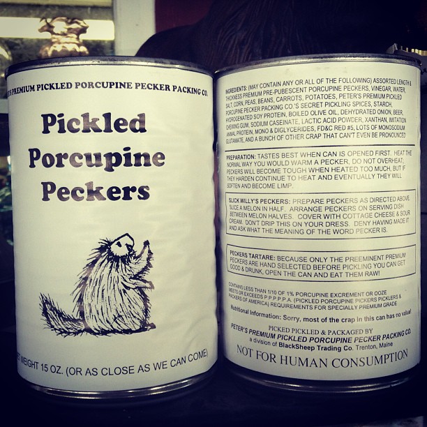 an opened can of pickled porepine peckers sitting on a shelf