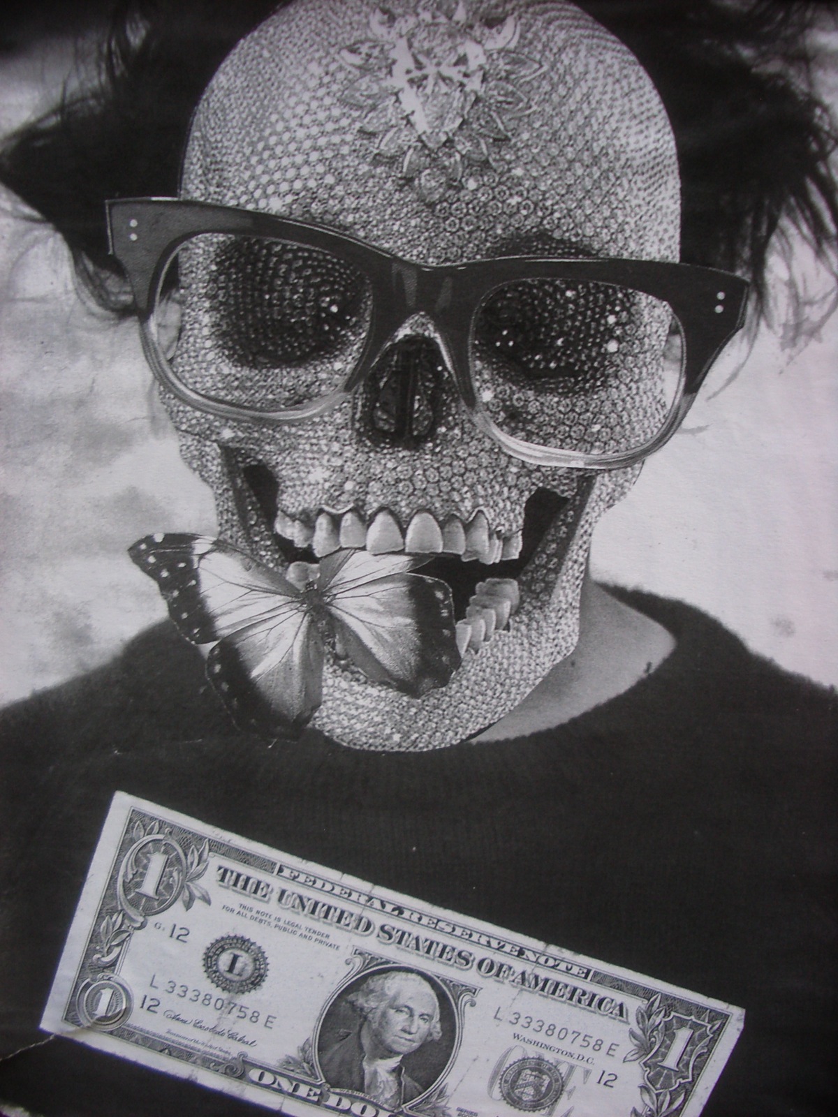 the girl in glasses has a skull with a erfly on it's forehead and an uncut bank note with an ad