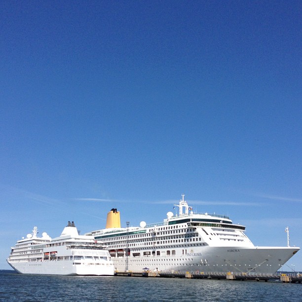 cruise ship in the distance under a blue sky