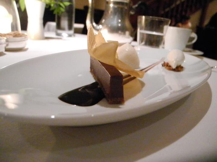 an entree dish with ice cream and chocolate on a white plate