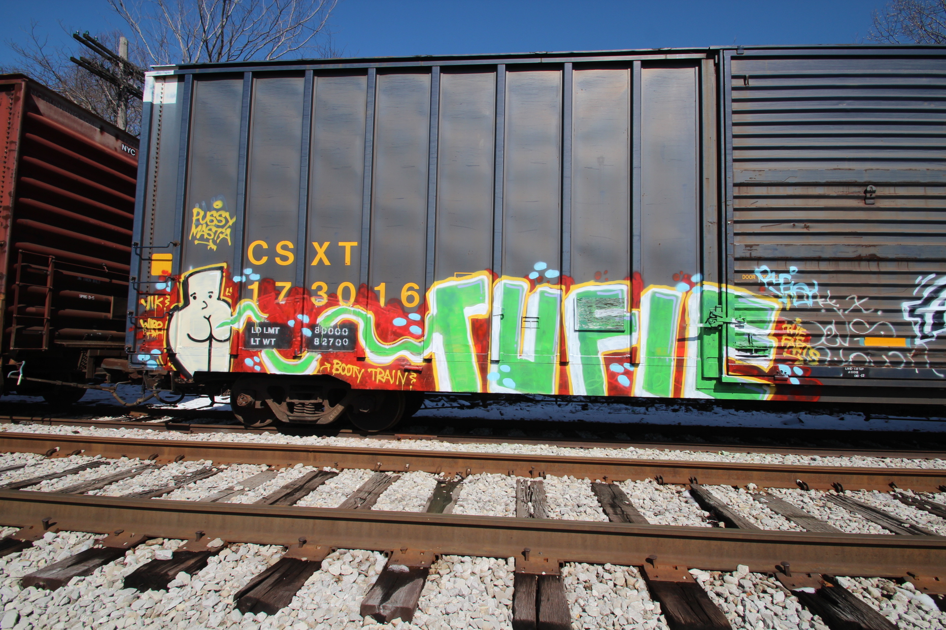 an image of a cargo car with colorful graffiti