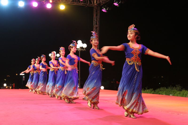 a dance performed in front of a crowd on a stage