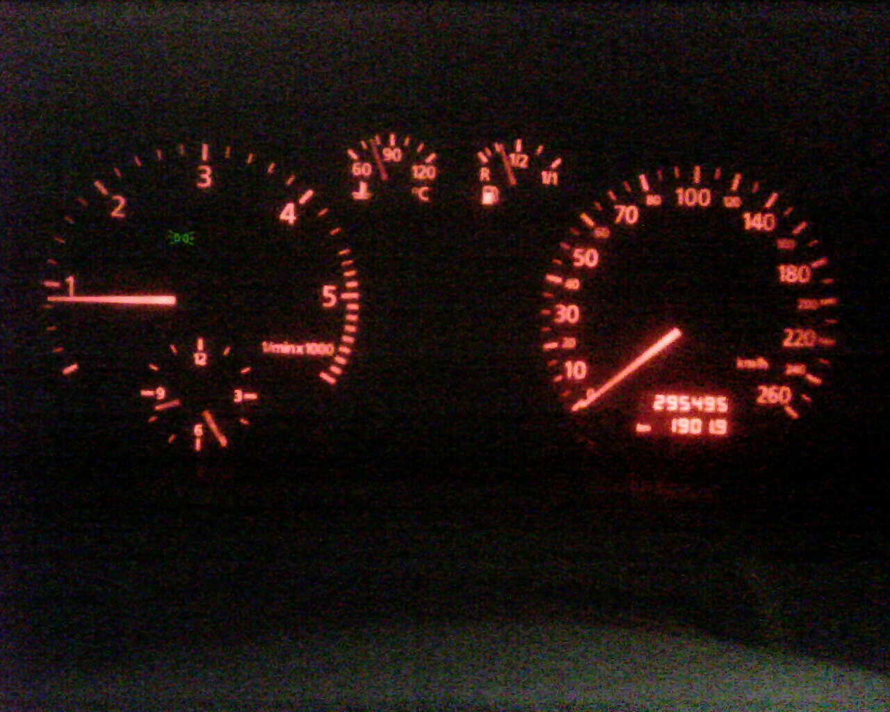 an illuminated gauge in the dash board of a car