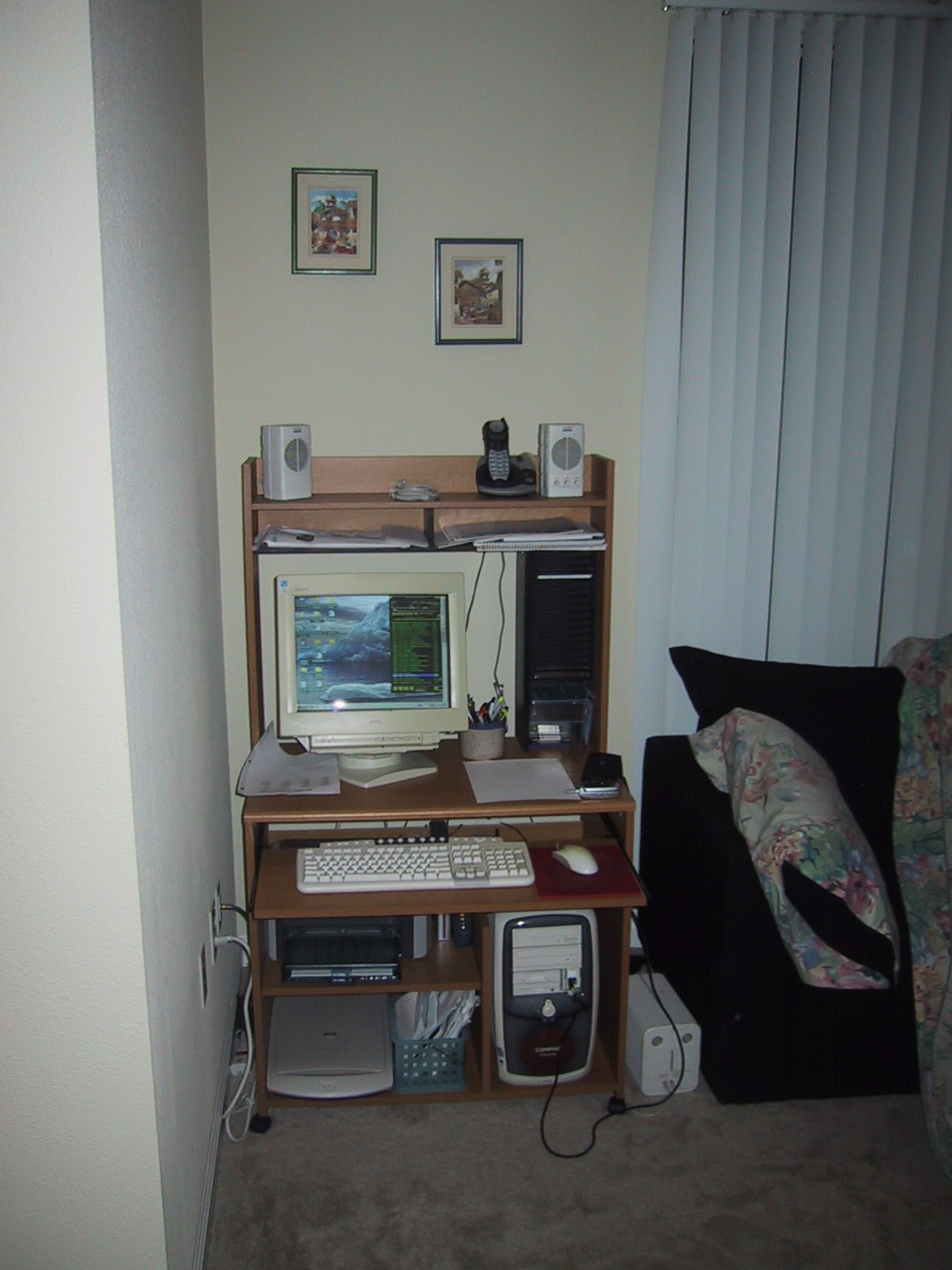 an open computer desk with a computer monitor and keyboard