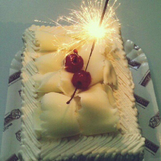 a sparkler made of cream cake sitting on a table
