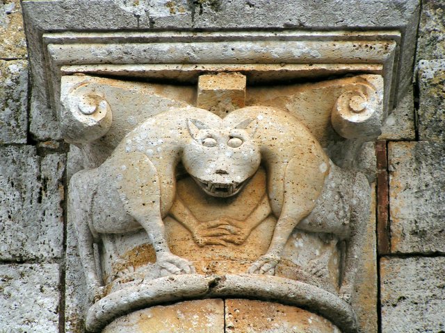 the stone carving shows a bear and a demon