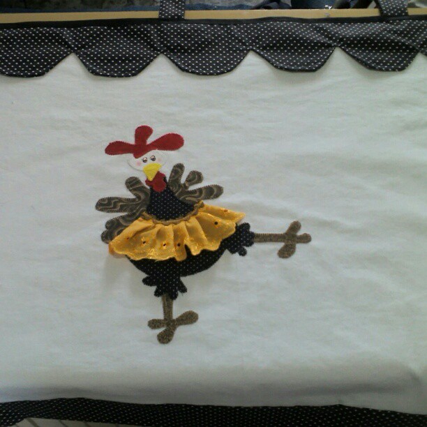 the embroidered chicken is standing on its own legs