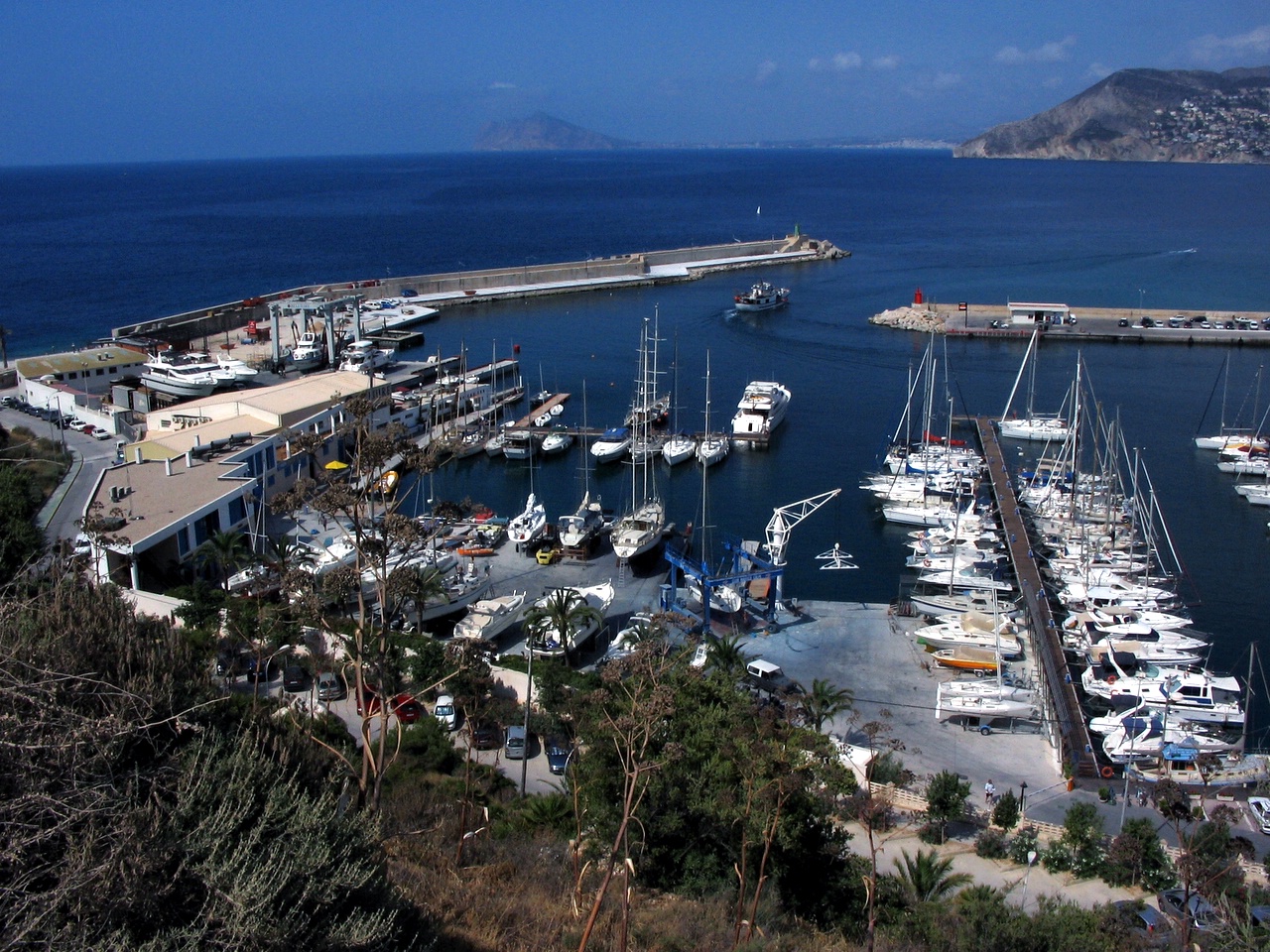 a marina with boats docked in it is very beautiful
